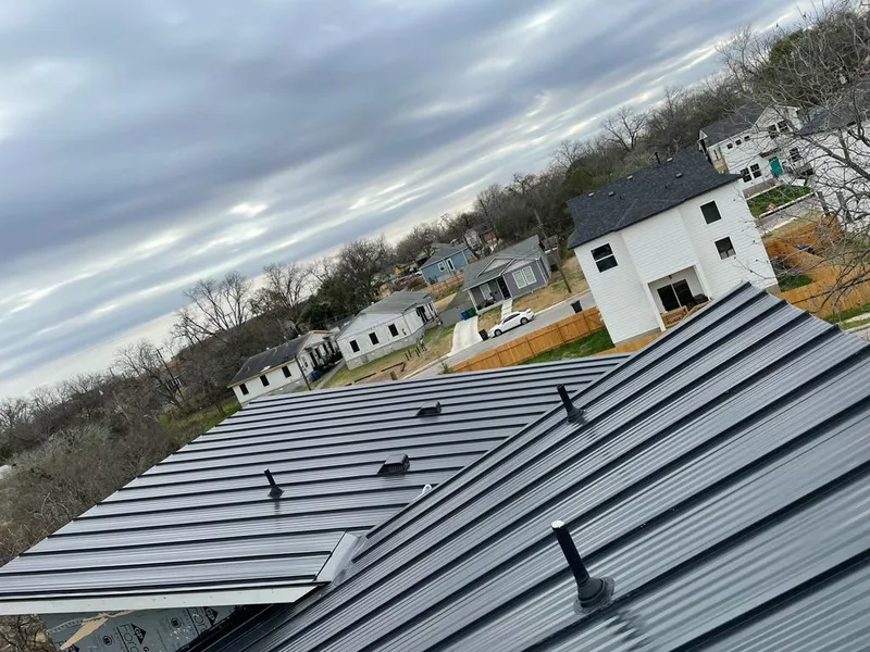 Standing seam metal roof panels with vents for Skylight Repair in South Burlington